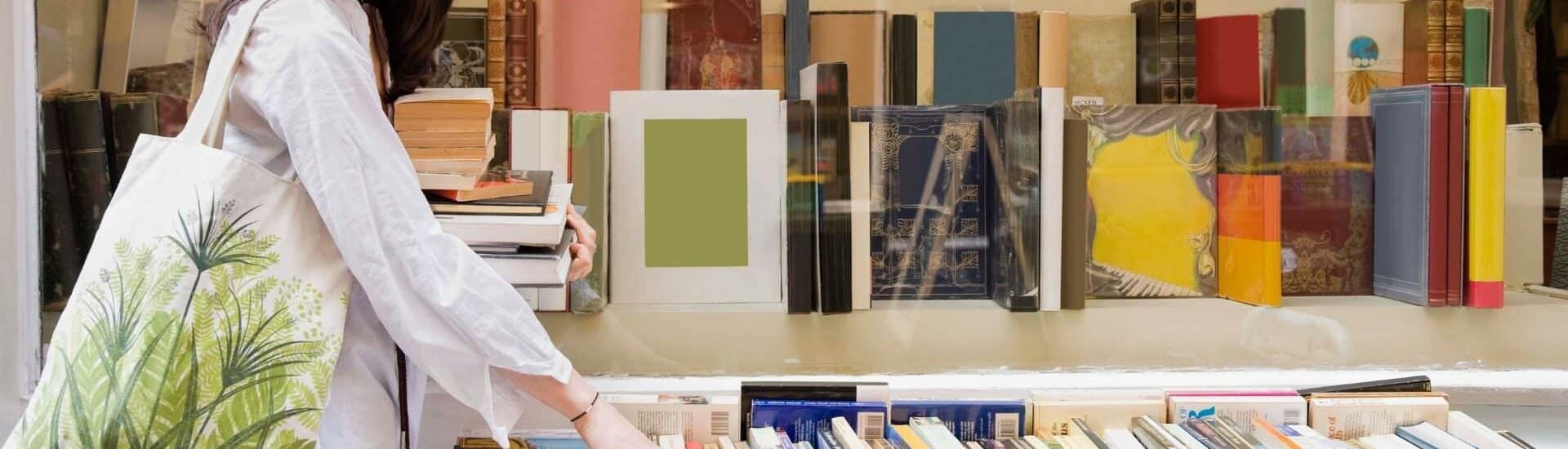 a woman is shopping at a bookstore
