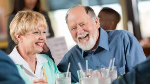 smiling senior couple dining at a restaurant